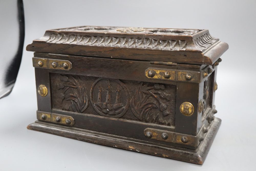 A brass bound wooden box, plaque to interior of lid reads made from oak, Old Parliament House, Edinburgh, 1493, length 30cm